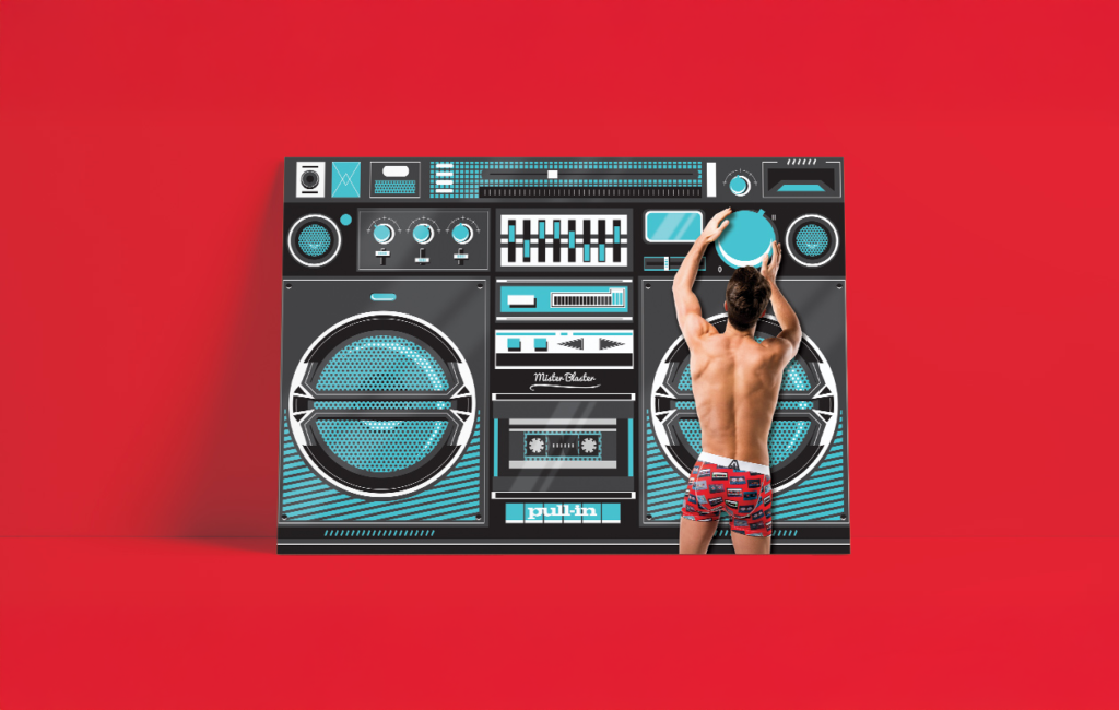 Visuel merchandising Pull-in avec homme en sous-vêtement et décor boombox